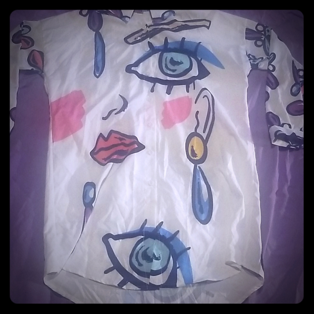 A long sleeve silk like botton down long shirt